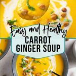 A bowl of carrot ginger soup garnished with a swirl of cream, herbs, and roasted chickpeas, with a spoonful being lifted out.