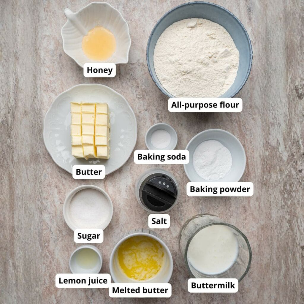 Top-down view of labeled ingredients for drop biscuits on a light surface.