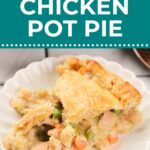 A slice of chicken pot pie with vegetables is served on a white plate, featuring a golden, flaky crust.