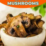 A bowl of cooked mushrooms garnished with herbs, with slices of lemon and more mushrooms around the bowl. Text reads: "Easy Air Fryer Garlic Mushrooms.