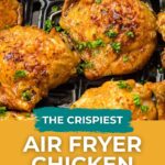 Four seasoned, cooked chicken thighs garnished with chopped herbs sit on an air fryer tray; text overlay reads "The Crispiest Air Fryer Chicken Thighs.
