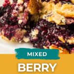 Close-up of a serving of mixed berry dump cake showing crumbly topping and juicy berry filling, with text overlay reading “Mixed Berry Dump Cake, Easy Homemade Life.”.